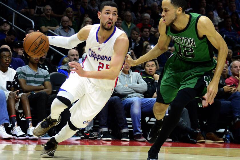 Celtics forward Tayshaun Prince defends against Clippers guard Austin Rivers. Prince could be soon playing beside Rivers in a Clippers uniform.