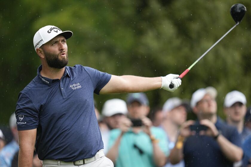 Jon Rahm, of Spain, watches his tee shot on the eighth hole during the second round of the PGA Championship golf tournament at Oak Hill Country Club on Friday, May 19, 2023, in Pittsford, N.Y. (AP Photo/Abbie Parr)