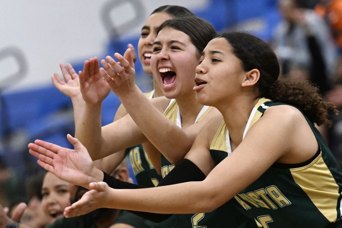 Mar Vista's players cheer their teammates during Thursday's CIF-San Diego Section Division V title-game win.