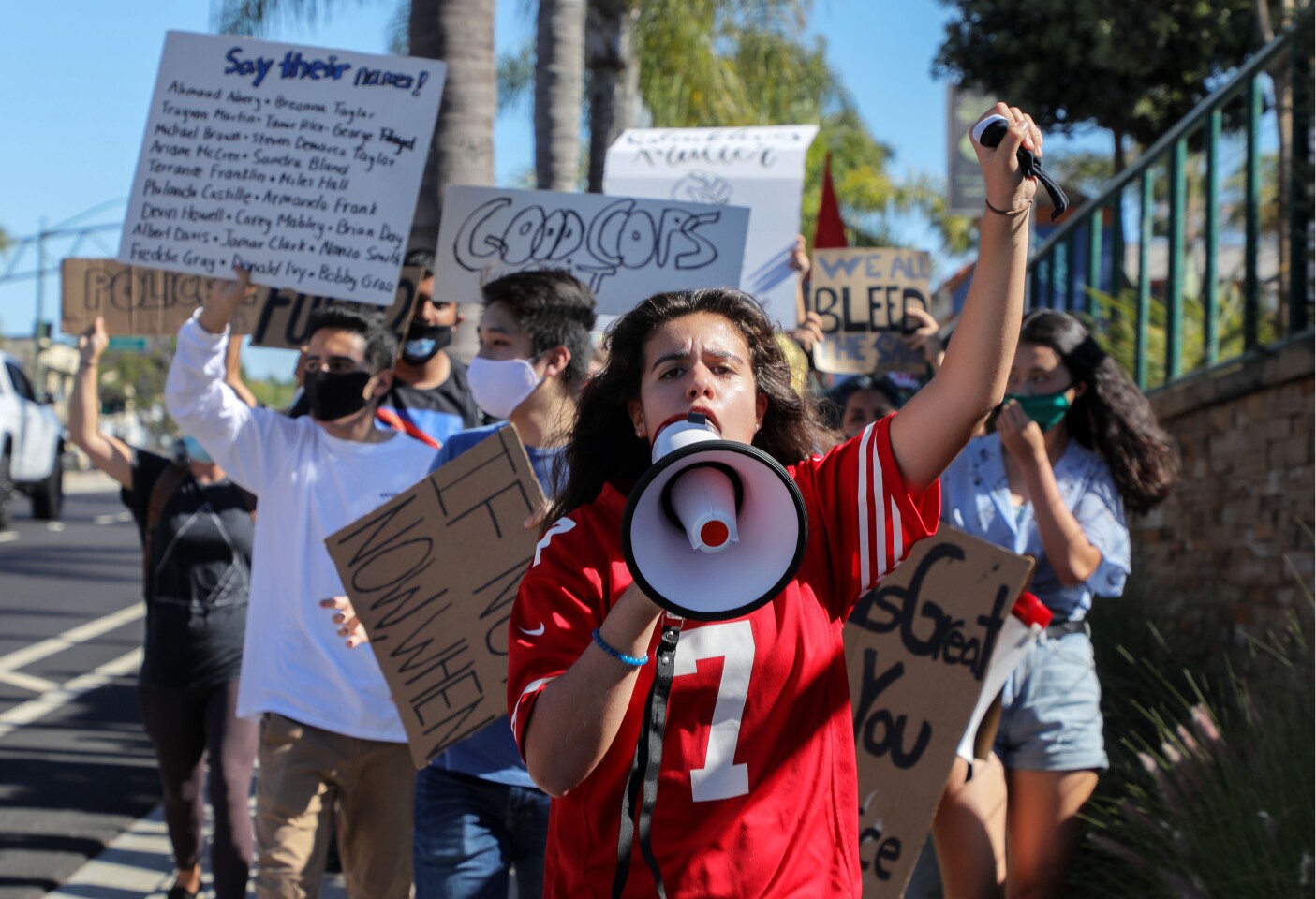 June 9, 2020_Encinitas, California, USA_| Martha Contreras speaks into a bullhorn as she leads a late afternoon Black Lives Matter protest north on Coast Highway 101. |_Photo Credit: Photo by Charlie Neuman