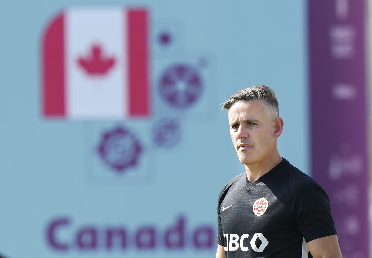 Canada head coach John Herdman watches his team during practice at the World Cup soccer tournament in Doha, Qatar Monday, Nov. 28, 2022. (Nathan Denette/The Canadian Press via AP)