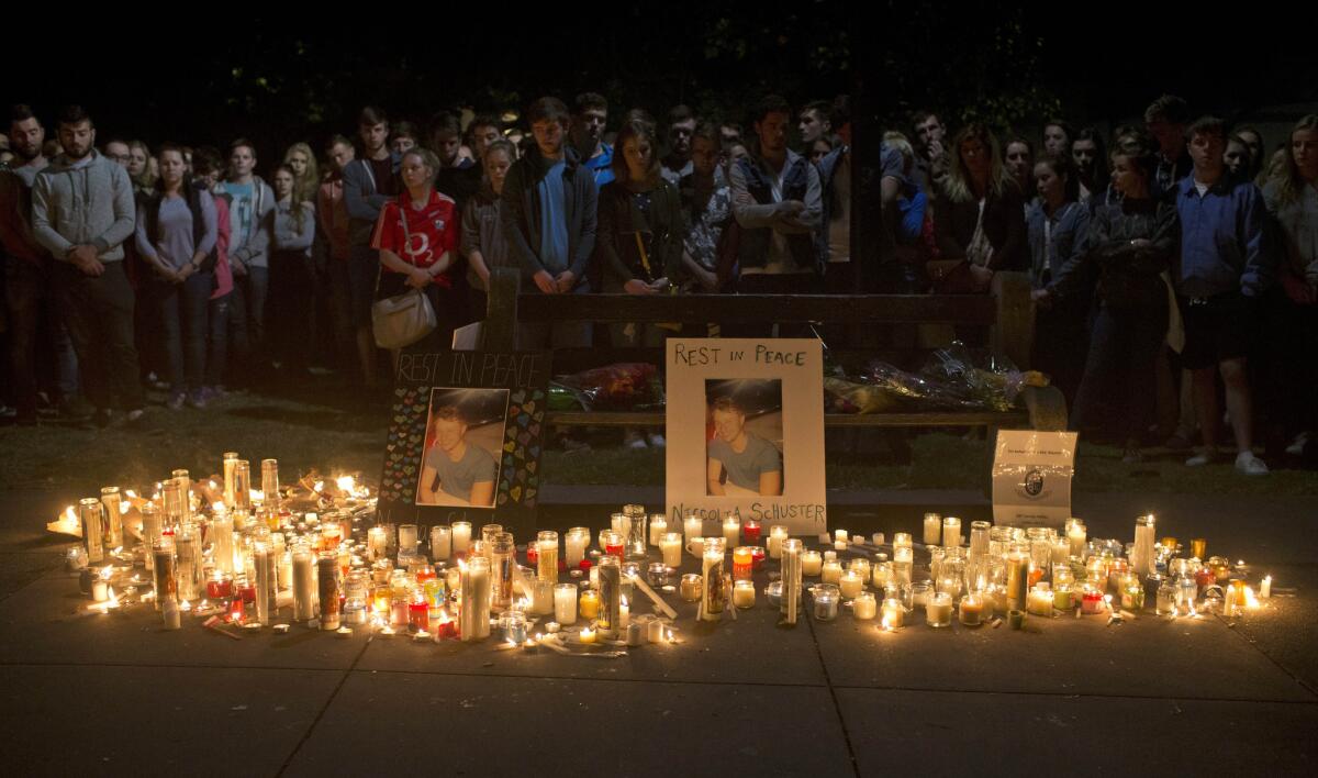 Mourners hold a vigil on June 17, 2015, for six students who died when an apartment building balcony collapsed in Berkeley.