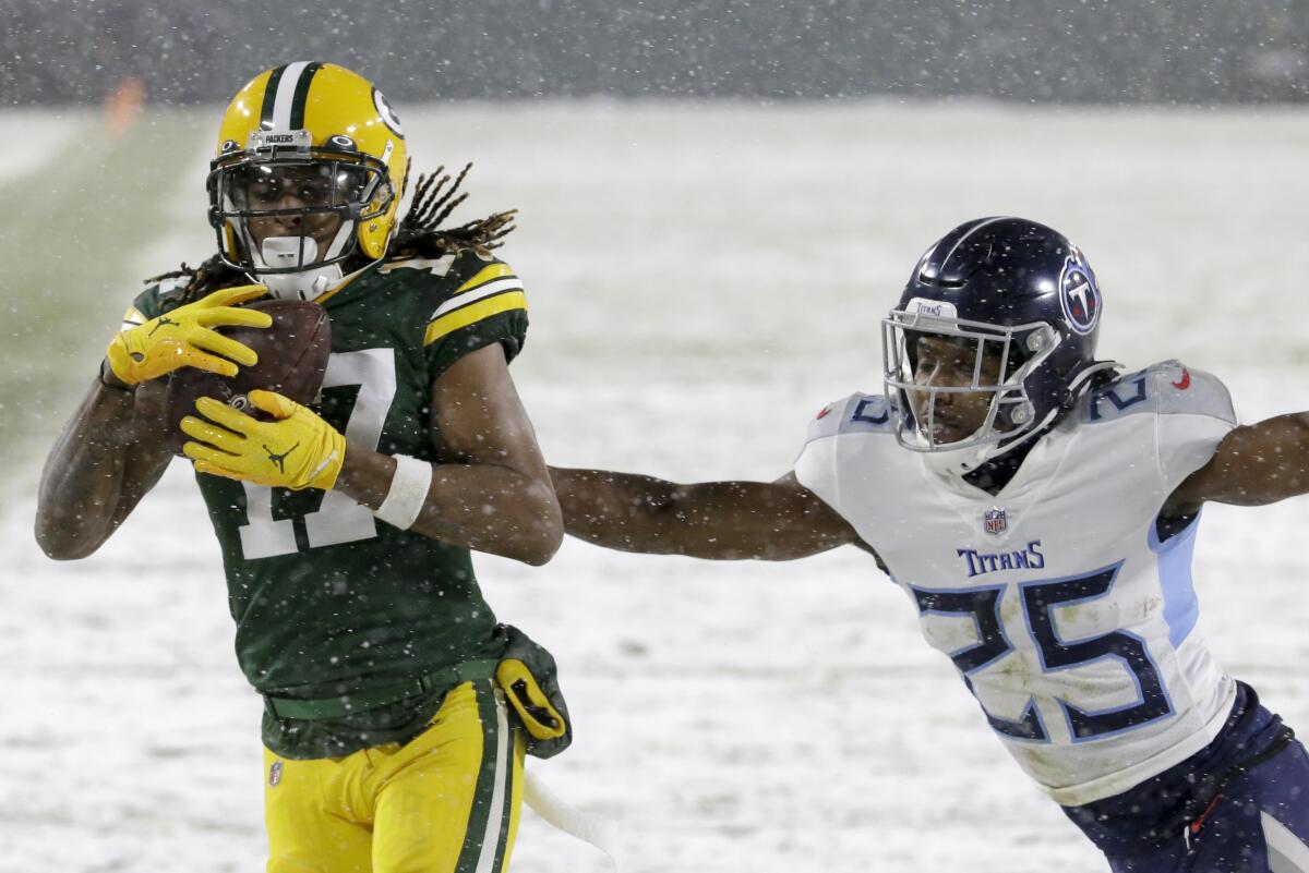 Green Bay Packers wide receiver Davante Adams catches a touchdown pass in front of Titans cornerback Adoree' Jackson.