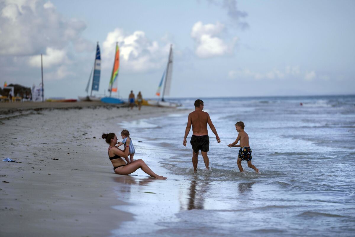 Tourists are seen along the beach at the Iberostar Selection Varadero hotel in Varadero, Cuba, on Sept. 29, 2021.