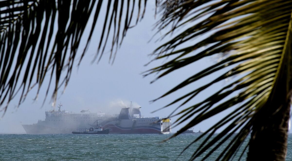 Smoke spills from the cruise ship Caribbean Fantasy off the coast of San Juan, Puerto Rico, on Aug. 17.