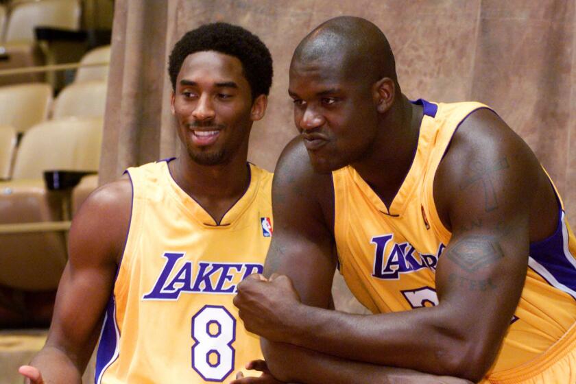 Los Angeles Lakers' Kobe Bryant, left, and Shaquille O'Neal pose for a photo during media day at the Great Western Forum in Inglewood, Calif., Monday, Oct. 4, 1999. The Lakers training camp opens in Santa Barbara, Calif., Tuesday, Oct. 5, 1999. (AP Photo/ Victoria Arocho) Original Filename: LAKERS_MEDIA_DAY_DGU.JPG