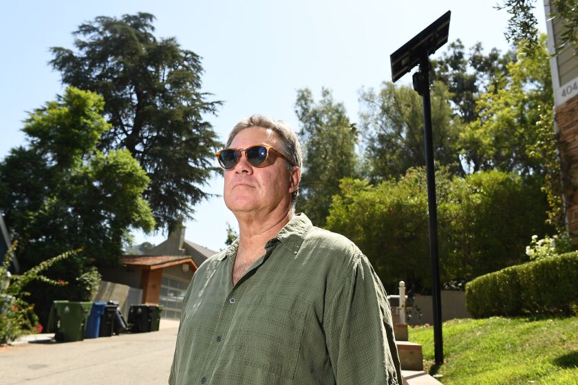 SHERMAN OAKS, CALIFORNIA SEPTEMBER 11, 2019-Bob Shontell, stands along s street in Sherman Oaks where security cameras are instslled to read license plates. (Wally Skalij/Los Angeles Times)