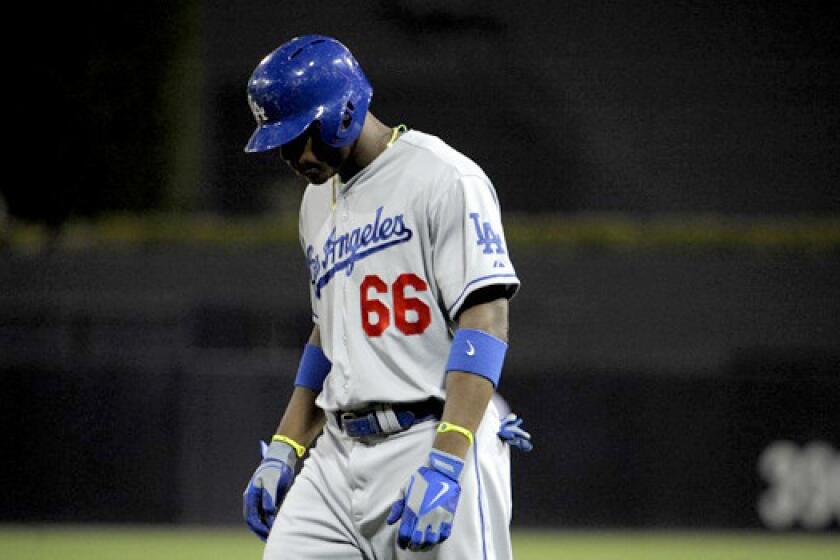 Yasiel Puig was 2 for 4 at the plate, but the Dodgers couldn't capitalize on the Padres loss of starting pitcher Clayton Richard, losing to San Diego, 5-2.