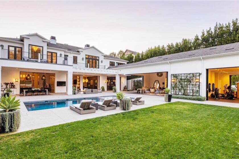 The nearly 13,000-square-foot showplace includes seven bedrooms, 12 bathrooms, a pool, tennis court, pool house and subterranean garage.