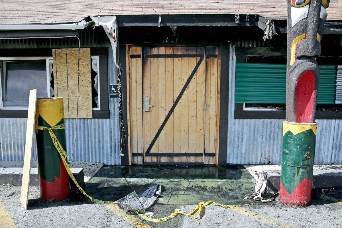 Broken windows and debris remain after a fire broke out over night at Taco Surf in Surfside on Friday, April 15, 2022.