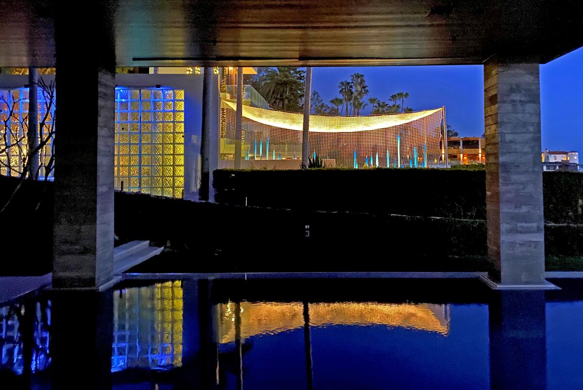 The blue glass lawn art on Bill Gross' Laguna Beach property, as seen from neighbor Mark Towfiq's pool.