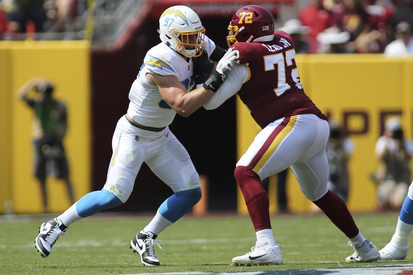 Los Angeles Chargers defensive end Joey Bosa (97) runs during an NFL football game against the Washington Football Team, Sunday, Sept. 12, 2021 in Landover, Md. (AP Photo/Daniel Kucin Jr.)