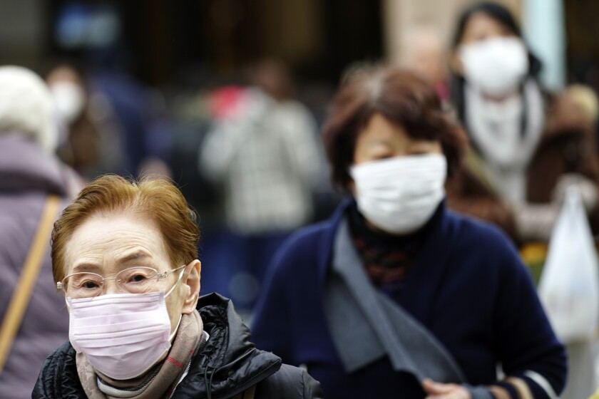 People wearing surgical-style face masks
