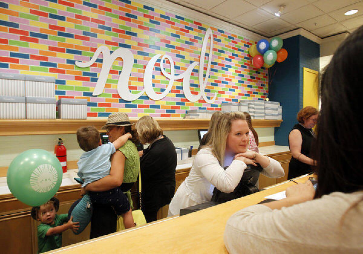 The checkout area of Land of Nod, the sister store of Crate & Barrel devoted to children's decor. The wall in back, which looks like candy-colored subway tile, was painted by the store's creative director.