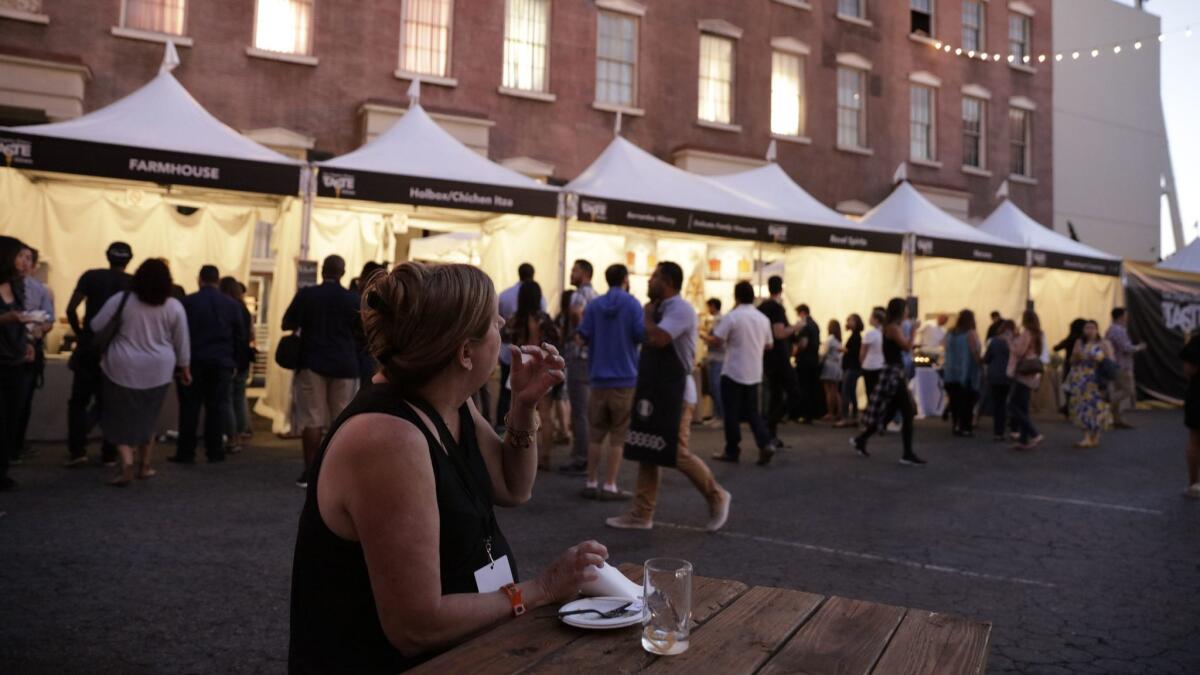 Festival attendees mingle and nosh at The Taste's opening night at the Paramount Pictures backlot.