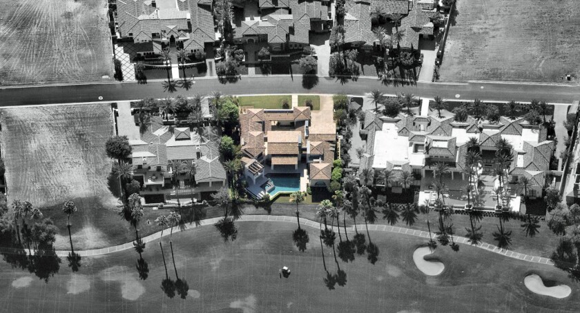 The roughly 5,500-square-foot Spanish contemporary-style home sits on more than a third of an acre.