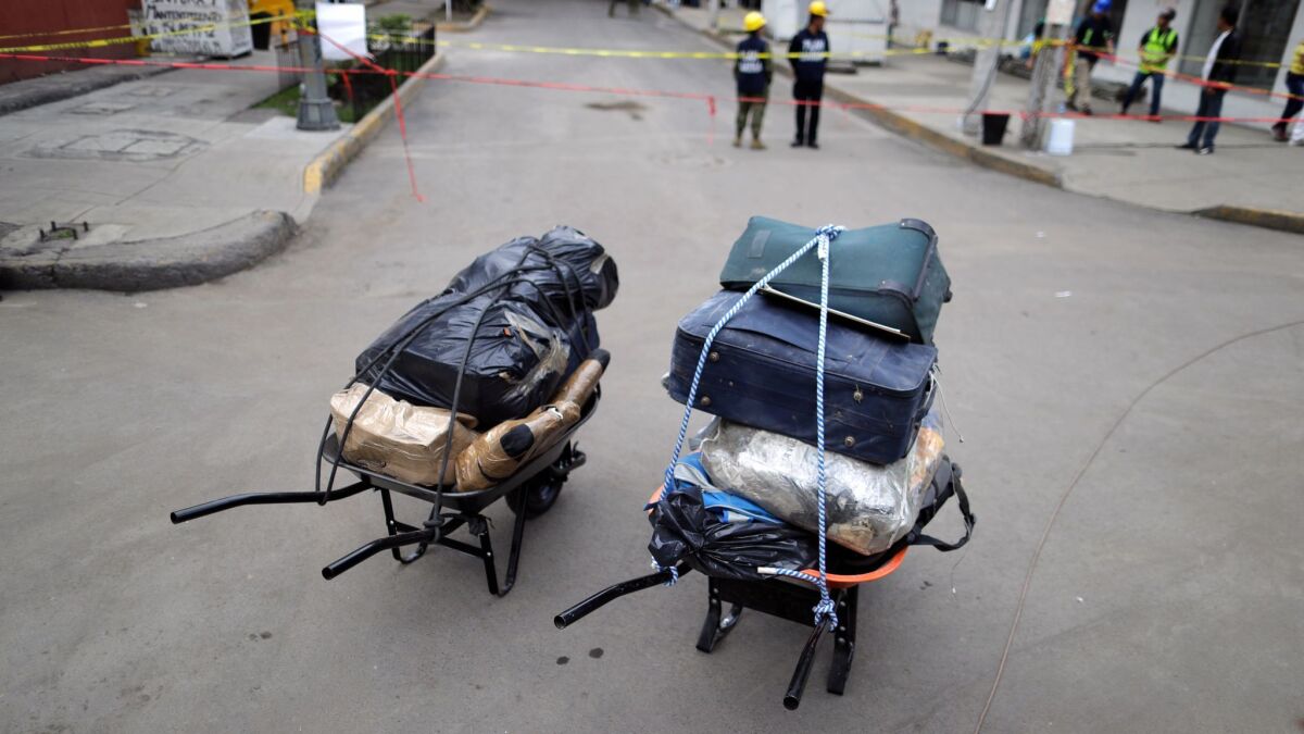 Wheelbarrows hold luggage of some of the residents who had to evacuate their apartment complex in the southern neighborhood of Tlalpan in Mexico City after September's powerful earthquake.