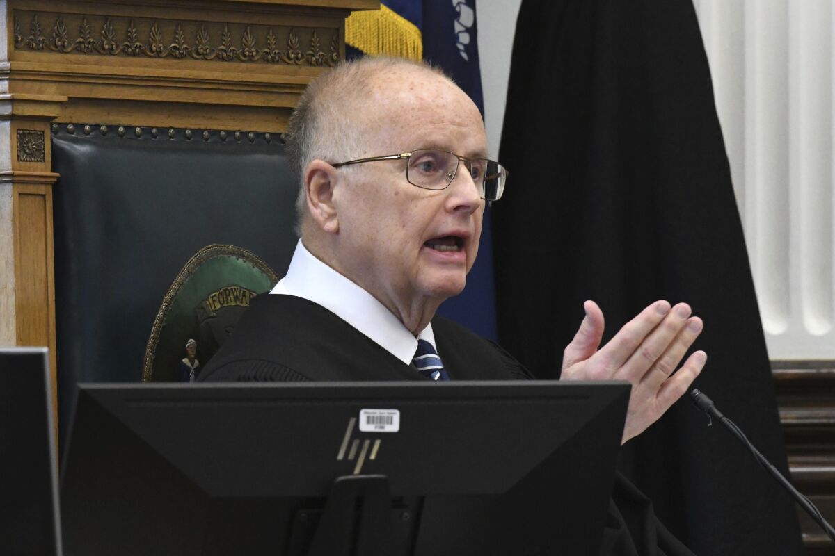 Circuit Court Judge Bruce E. Schroeder addresses the jury pool at the start of jury selection during trial for Kyle Rittenhouse in Kenosha Circuit Court, Monday, Nov. 1, 2021, in Kenosha, Wis. Rittenhouse, an aspiring police officer, shot two people to death and wounded a third during a night of anti-racism protests in Kenosha last year. (Mark Hertzberg/Pool Photo via AP)