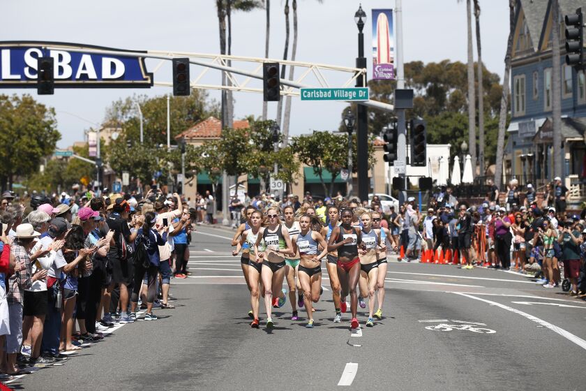 Women run in the elite division of the Carlsbad 5000 in Carlsbad on April 7, 2019. Sharon Lokedi, right, won the division with a time of 15:47. Charlotte After, left, was second and Danielle Shanahan was third. (Photo by K.C. Alfred/The San Diego Union-Tribune)