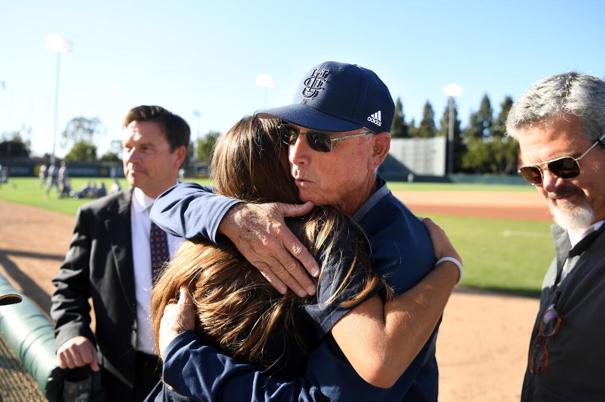 UC Irvine baseball coach Mike Gillespie hugs a family member before a 2018 game