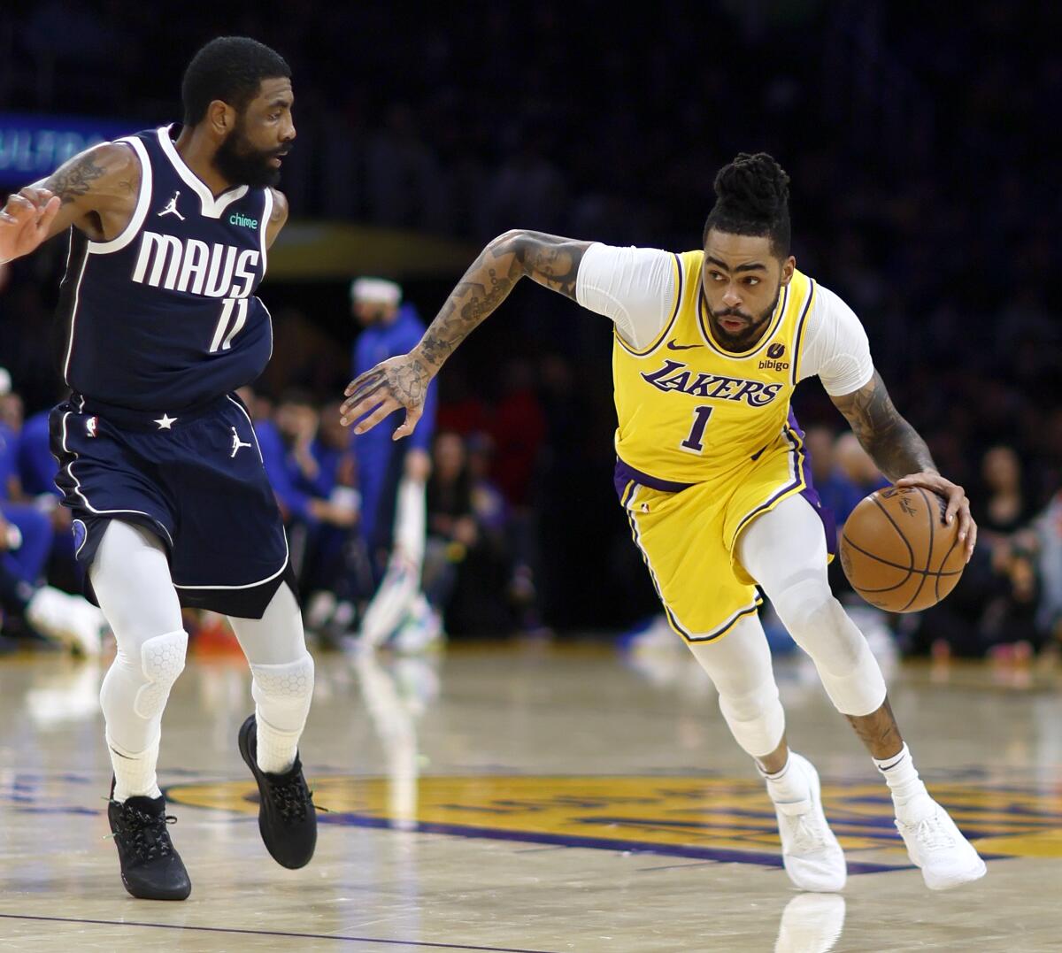 D'Angelo Russell drives against Kyrie Irving.