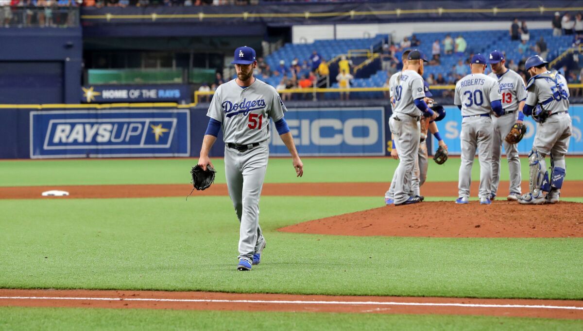 Dodgers pitcher Dylan Floro walks off after being relieved in the seventh inning against the Tampa Bay Rays on May 22.
