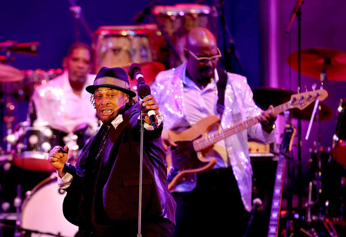 D'Angelo, left, performs during "Get On Up: A James Brown Celebration" at the Hollywood Bowl on Aug. 13, 2014.
