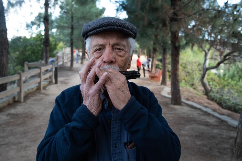 Los Angeles, CA - Portrait of Pete Teti hiker, artist, teacher, and WWII Veteran in Griffith Park early in the morning on Thursday, Nov. 23, 2023, in Los Angeles, CA. Pete turns 100 years old this week. (Francine Orr / Los Angeles Times)