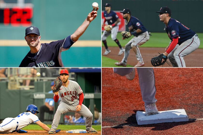 A pitch clock, defensive-shift and pickoff-throw limits and bigger bases are among the new features to the 2023 MLB rulebook.