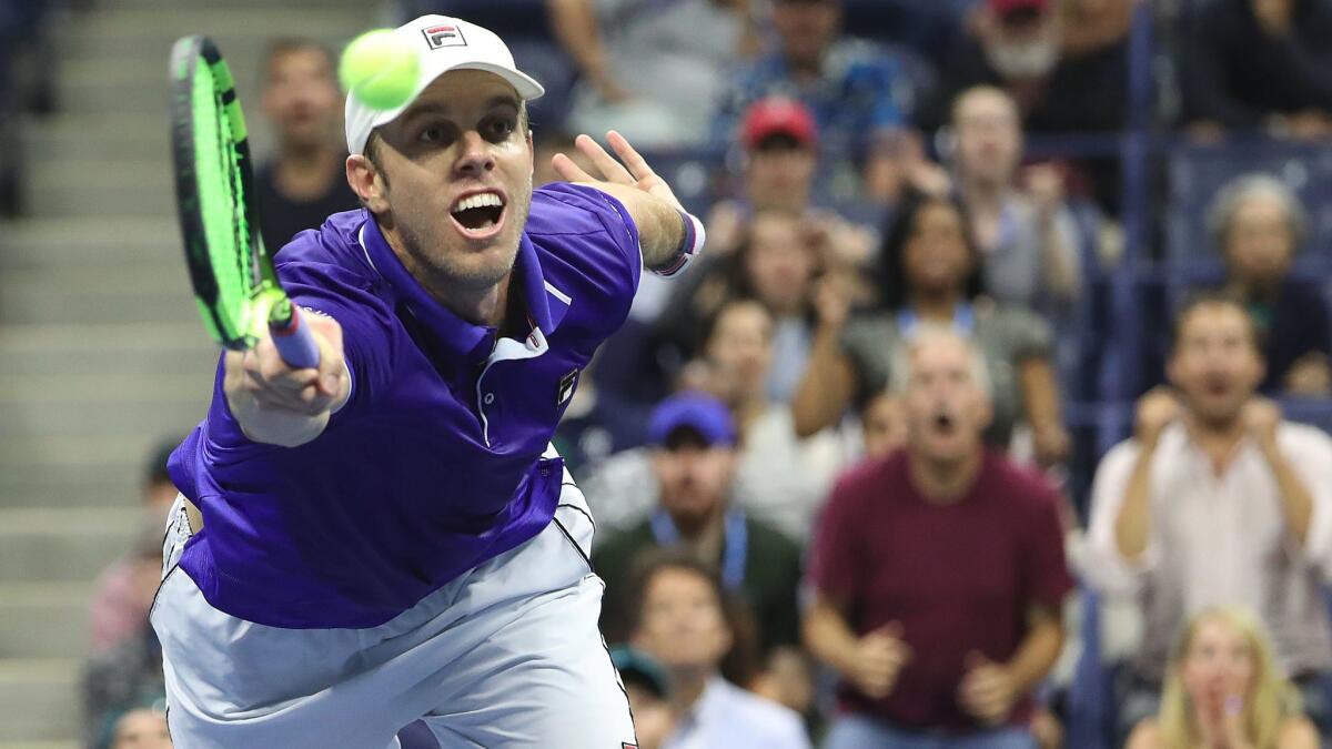 Sam Querrey hits a return to Kevin Anderson during their U.S. Open quarterfinal match on Sept. 5.
