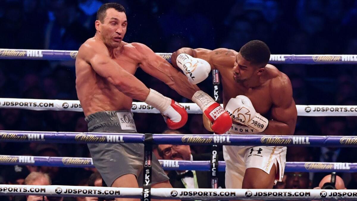 Anthony Joshua, right, fights Wladimir Klitschko on April 29, 2017, at Wembley Stadium in London on April 29, 2017.