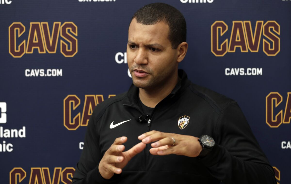 FILE - In this April 12, 2019, file photo, Cleveland Cavaliers general manager Koby Altman speaks to the media at the NBA basketball team's training facility in Independence, Ohio. Altman has been rewarded for the team’s turnaround with a contract extension and new job title, a person familiar with Cleveland’s plans told the Associated Press on Tuesday night, Jan. 11, 2022. Altman will also assume the new title of president of basketball operations, the person said. (AP Photo/Tony Dejak, File)