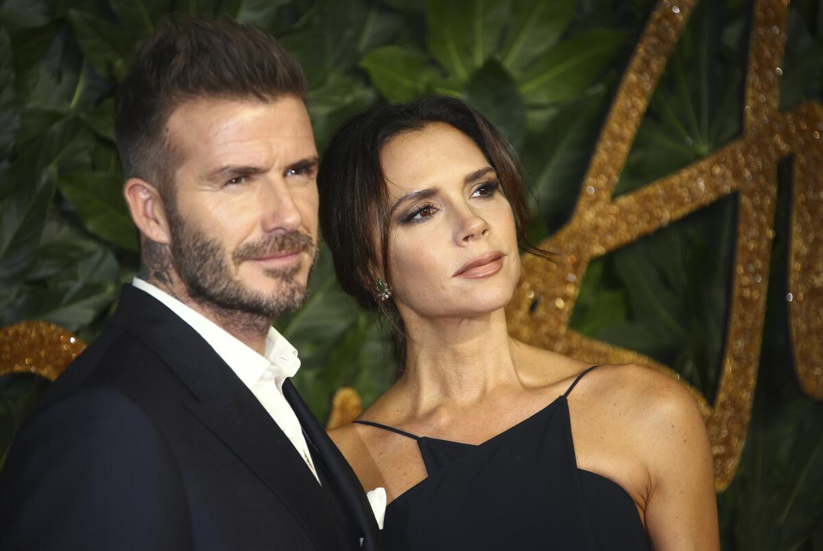 Former soccer player David Beckham and designer Victoria Beckham in 2018