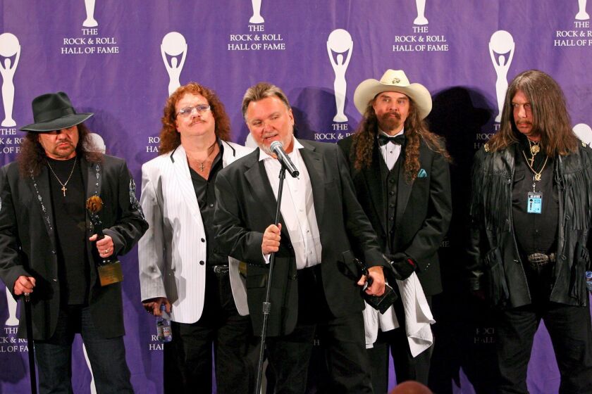Members of Lynyrd Skynyrd, left to right, Gary Rossington, Bill Powell, Ed King, Artimus Pyle and Robert Burns Jr., talk to the media at the Rock and Roll Hall of Fame induction ceremonies in 2006.