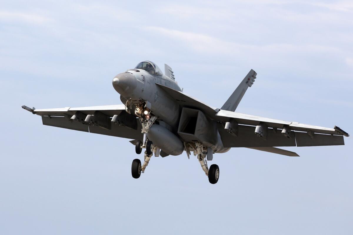 A Navy F/A-18 Super Hornet landing in Japan during a training exercise. A similar plane crashed Wednesday night off Southern California.