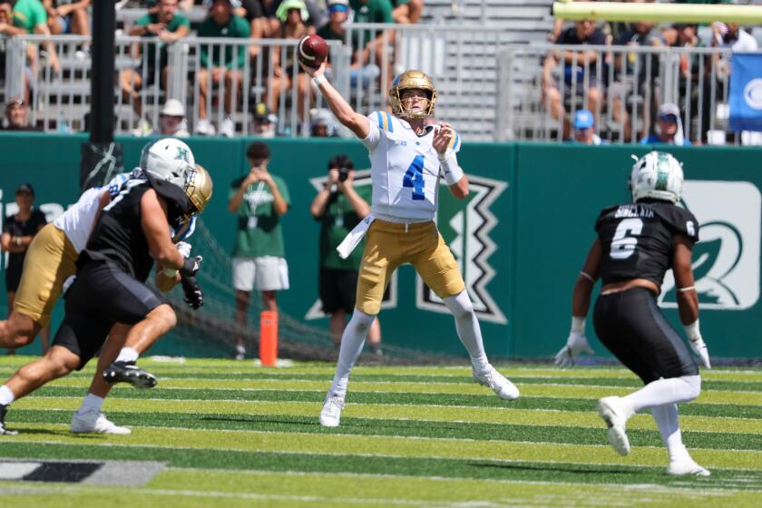 HONOLULU, HI - AUGUST 31: Ethan Garbers #4 of the UCLA Bruins throws a pass downfield.