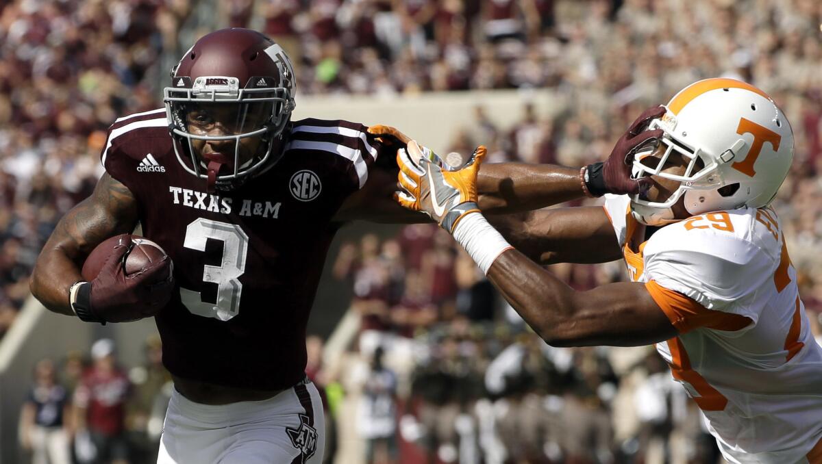 Texas A&M receiver Christian Kirk (3) breaks away from Tennessee defensive back Evan Berry (29) to score a touchdown during the first half.