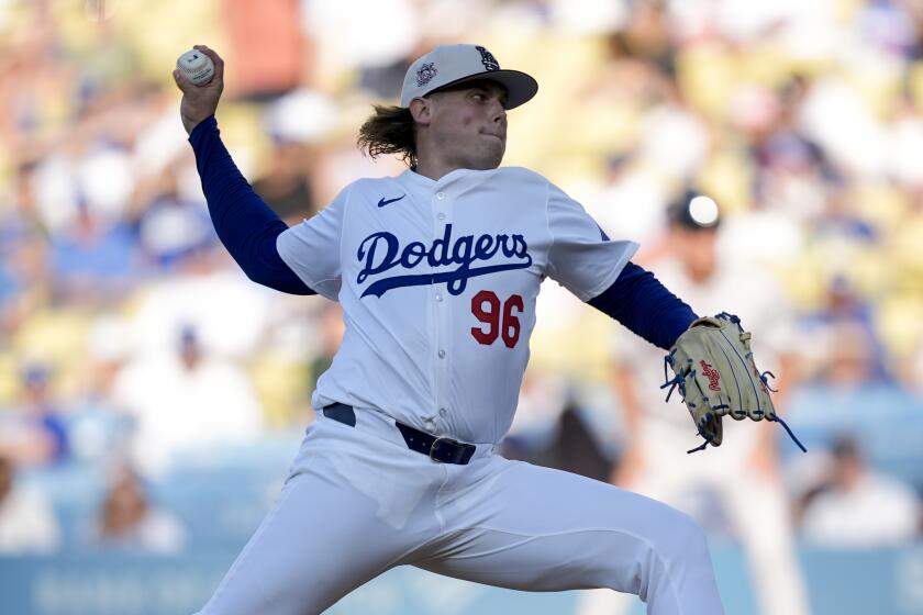 Los Angeles Dodgers starting pitcher Landon Knack throws during the first inning.