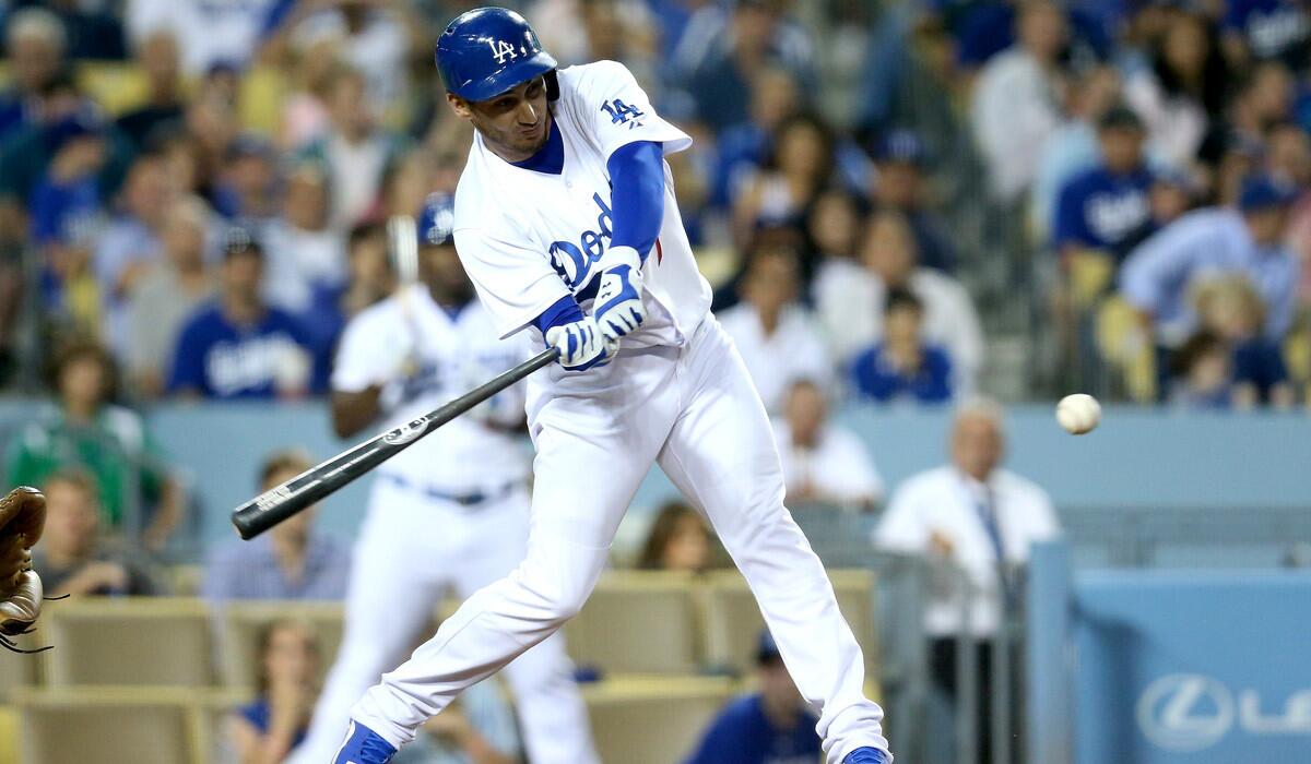 Dodgers' Alex Guerrero hits a pinch-hit RBI single in the sixth inning against the Texas Rangers on June 17.