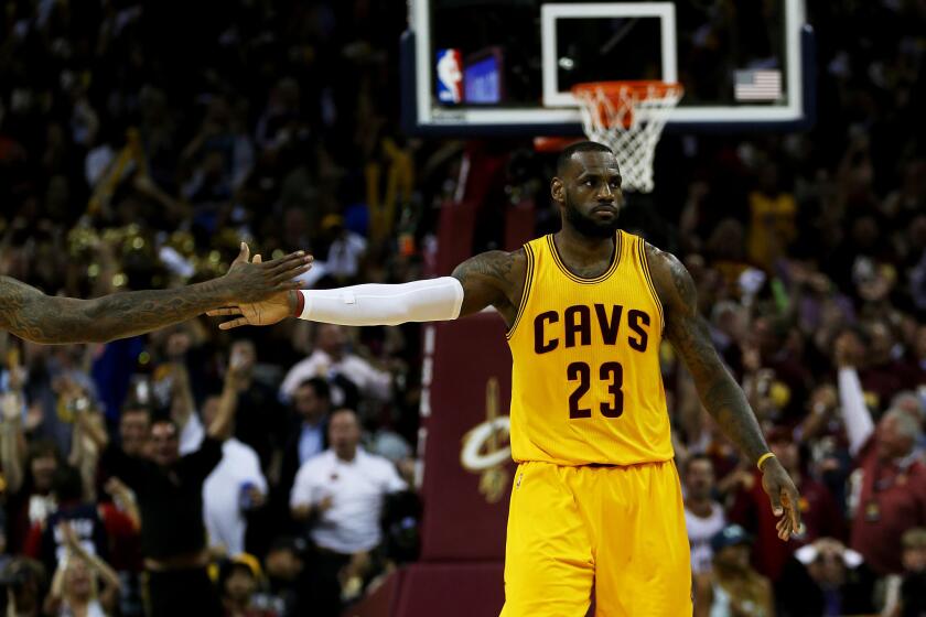 Cavaliers forward LeBron James reacts during the third quarter of Game 3 of the NBA Finals against the Golden State Warriors.