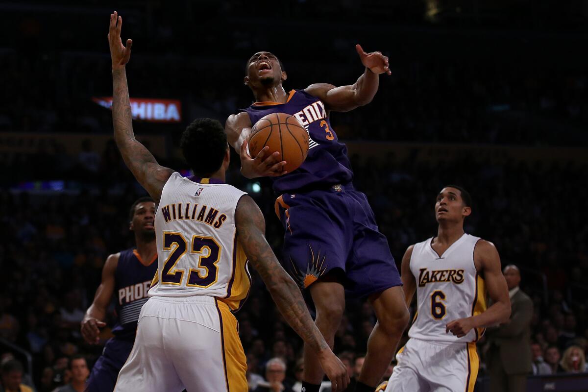 Lakers guards Lou Williams and Jordan Clarkson surround Phoenix Suns guard Brandon Knight during a Jan. 3 game at Staples Center.