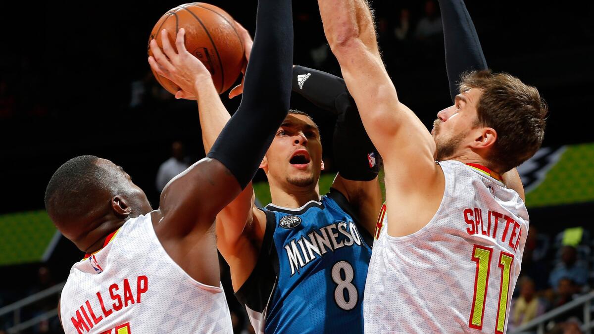 Timberwolves guard Zach LaVine tries to score inside against Hawks forward Paul Millsap and center Tiago Splitter during a game Nov. 9.