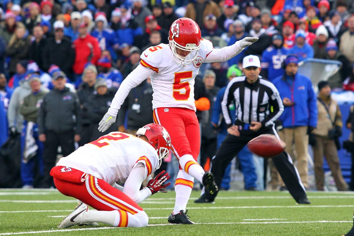 Cairo Santos (5) kicks an extra point for the Kansas City Chiefs with Dustin Colquitt holding against the Buffalo Bills in November 2014. The Rams signed Santos on Tuesday.