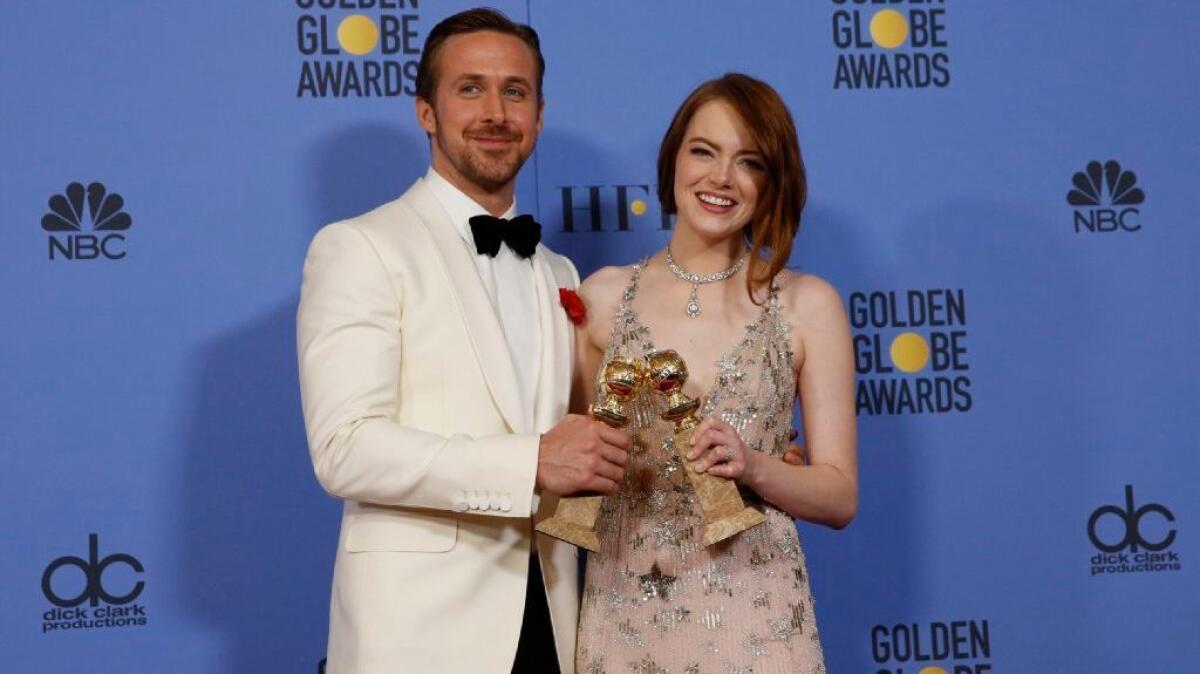 Ryan Gosling and Emma Stone, holding their Golden Globe awards for "La La Land," offer star-power style at the 74th Golden Globe Awards show at the Beverly Hilton Hotel on Jan. 8.