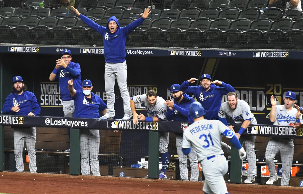 The Dodgers dugout erupts after a solo home run by Joc Pederson during the second inning in Game 5 of the World Series.