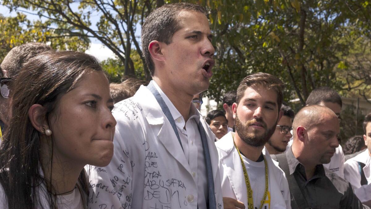 Self-proclaimed interim President Juan Guaido, center, participates in an opposition demonstration in Caracas on Wednesday.