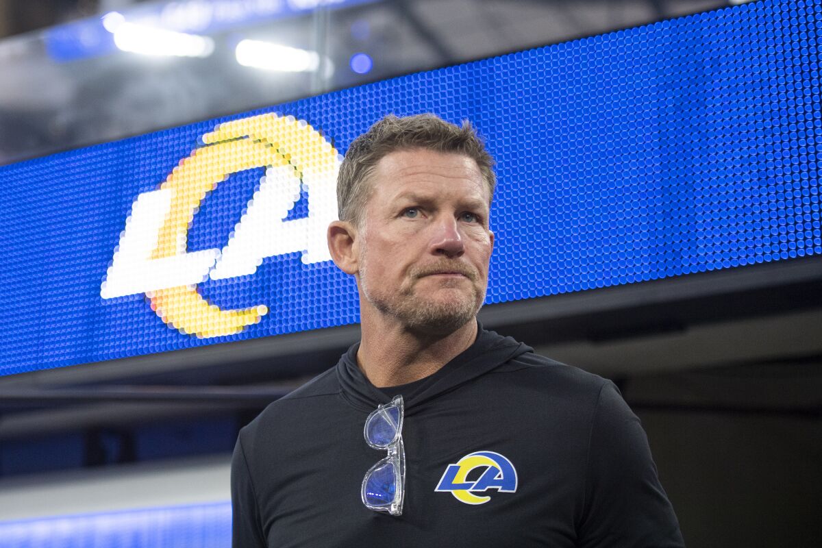 Rams general manager Les Snead walks on the SoFi Stadium field.