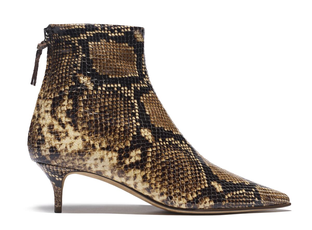 Emme Parsons' Julien leather ankle boot in tan-black snakeprint.