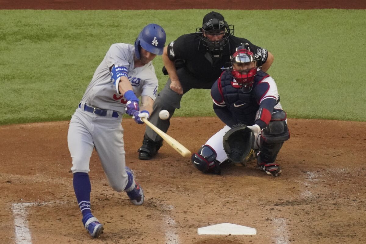 Dodgers center fielder Cody Bellinger hits a home run against the Atlanta Braves.
