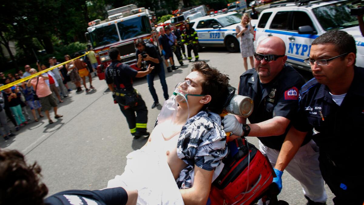 An injured man lies on a stretcher after a reported explosion in New York's Central Park on Sunday.